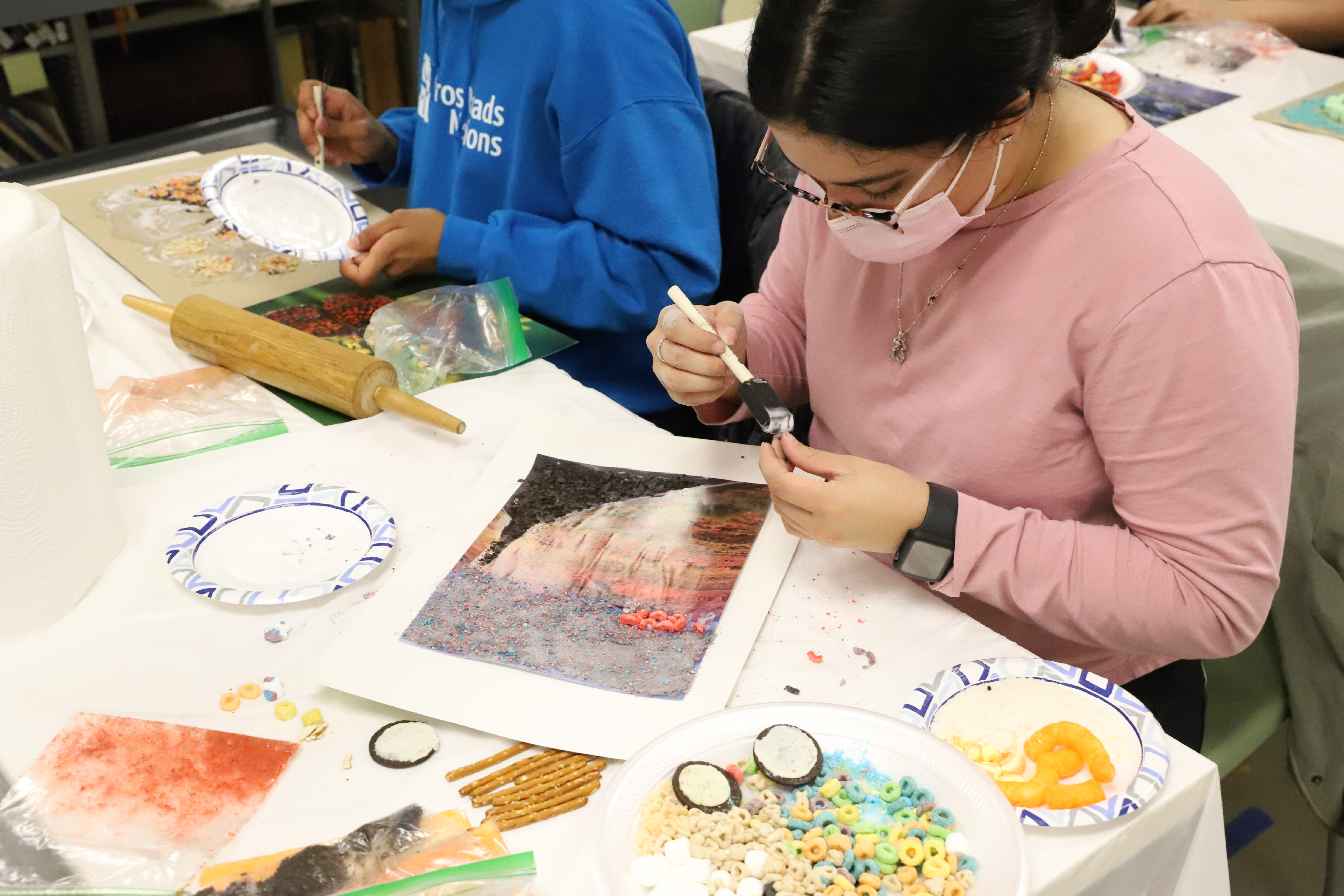 Student Displaying Art Piece